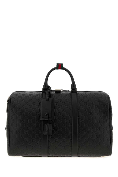 Gucci Duffle with shoulder, address and keys tag, padloc