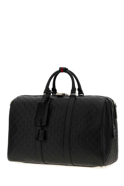 Gucci Duffle with shoulder, address and keys tag, padloc