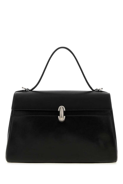 SOFT SYMMETRY IN VINTAGE CALF LEATHER HANDBAGS
