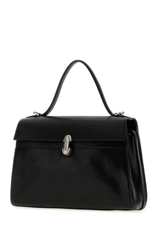 SOFT SYMMETRY IN VINTAGE CALF LEATHER HANDBAGS
